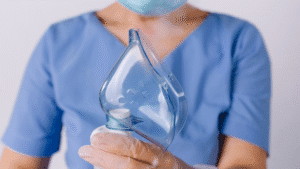 Medical professional holding a nebulizer mask